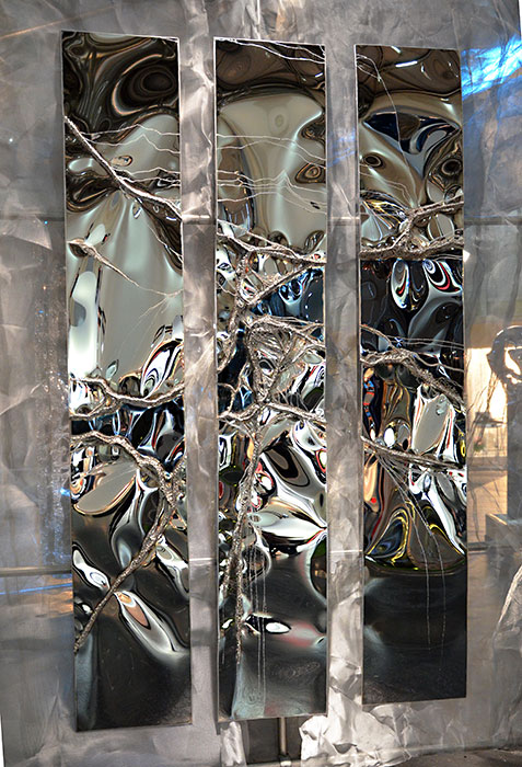welded wall sculpture | mirror polished stainless steel